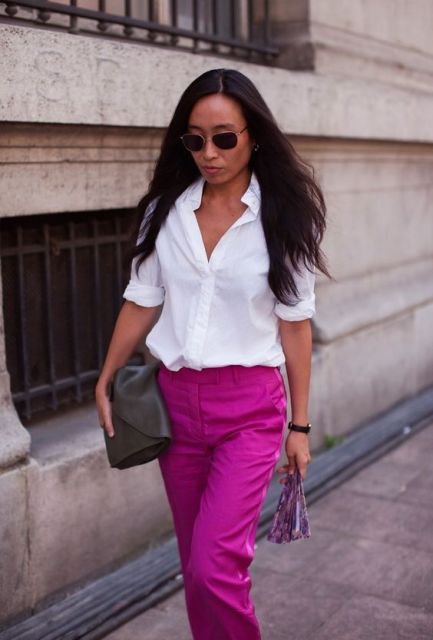 With white shirt, black clutch and sunglasses