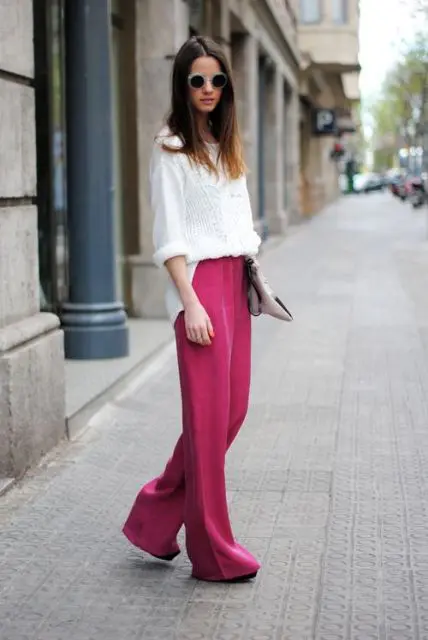 With white sweater and clutch