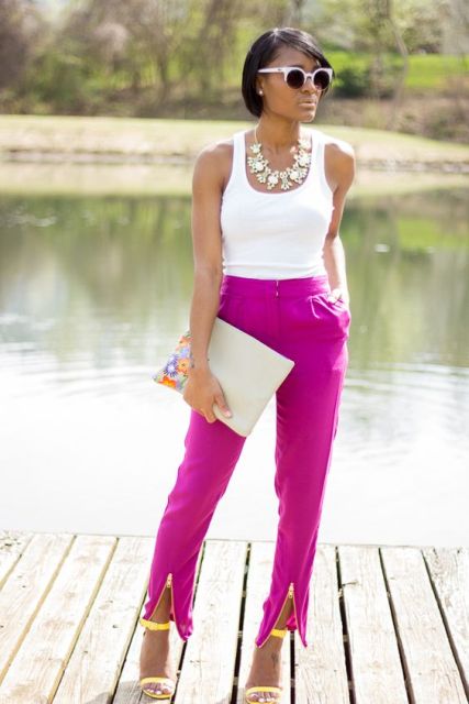 Fuchsia pants with white top, floral clutch and yellow heels are perfect if you want an eye-catchy work outfit.