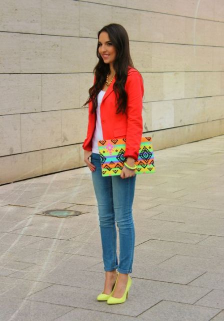 With white top,jeans and printed clutch