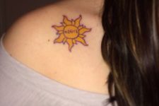 Yellow sun tattoo with date
