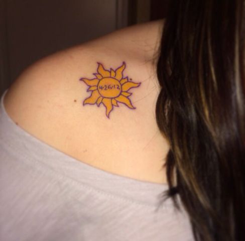 Yellow sun tattoo with date