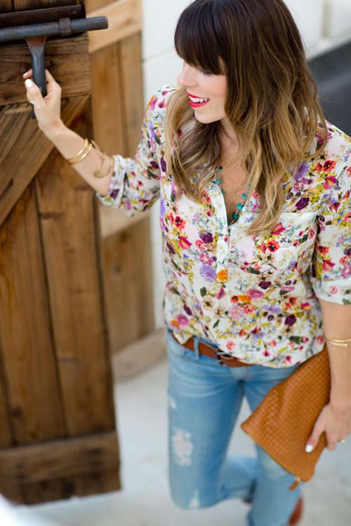 a bold floral blouse, ripped skinnies and a brown belt