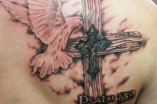 03 religious cross tattoo with a psalm number and a bird on a shoulder