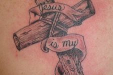 04 a wooden cross tattoo has a religious meaning