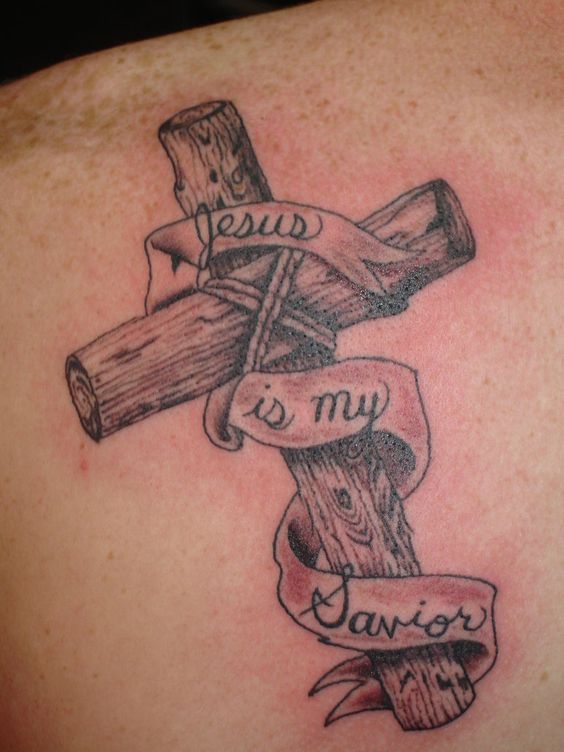a wooden cross tattoo has a religious meaning