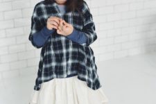 casual look with an ivory skirt, a checked shirt and ivory boots