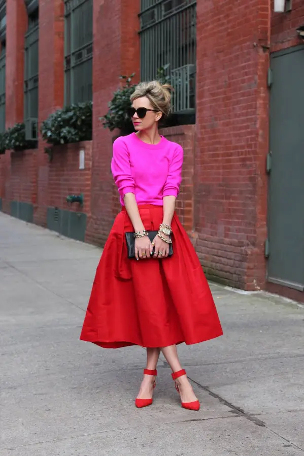 a red midi, a pink top and red poainted shoes