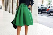 a green skirt, a black top, leopard print shoes and a black moto jacket