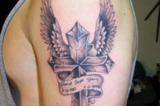 07 a large cross tattoo with wings in honor of a dead friend