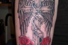 08 a metal cross tattoo with wings commemorating the dead