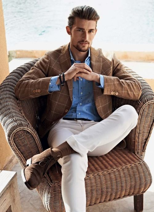 brown windowpane jacket, a polka dot blue shirt, white pants and brown suede shoes