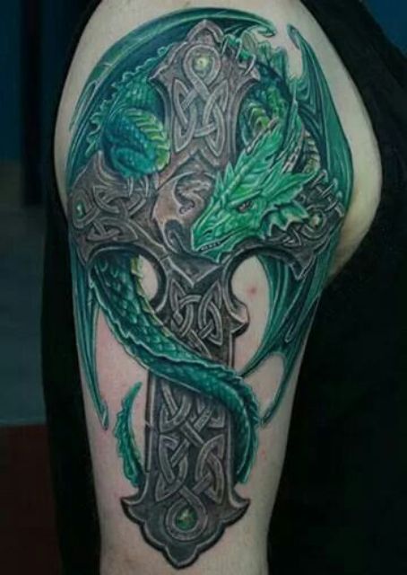 a 3D Celtic cross with a green dragon