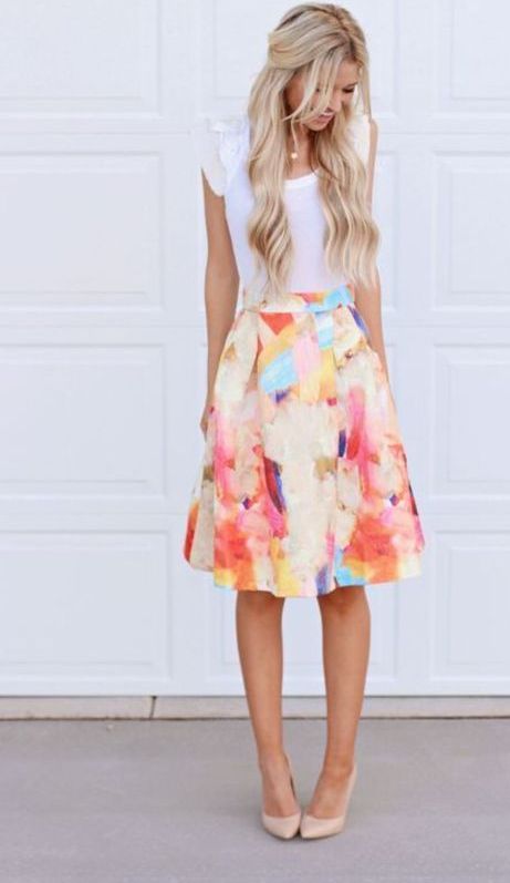 a watercolor flower knee skirt spring outfit with a white top and nude heels