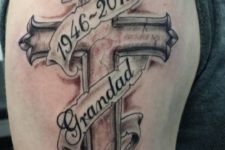 12 a cross on an arm to commemorate a dead grandfather