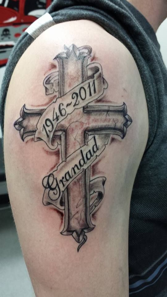 a cross on an arm to commemorate a dead grandfather