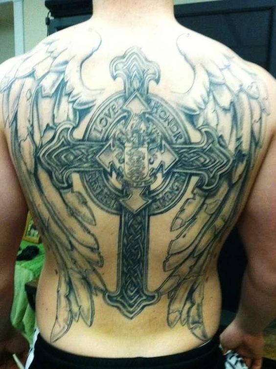 a large cross and wings backpiece