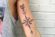 13 arrow compass tattoo on an arm