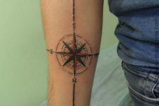 14 black and red compass tattoo