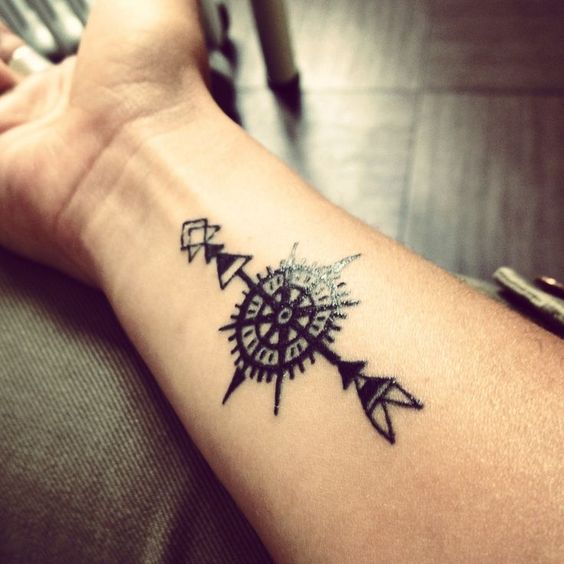 black ink compass arrow tattoo