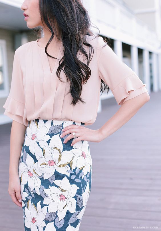 a blush short sleeve blouse and a floral pencil skirt