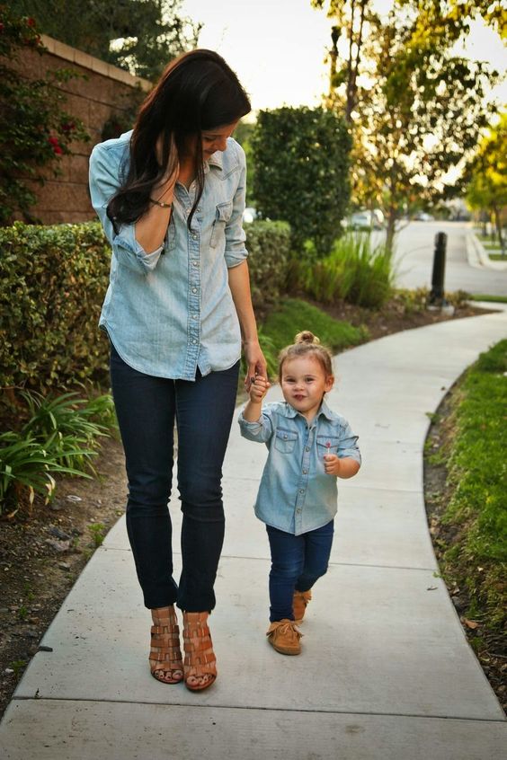 navy jeans, a distressed chambray shirt and brown moccasins