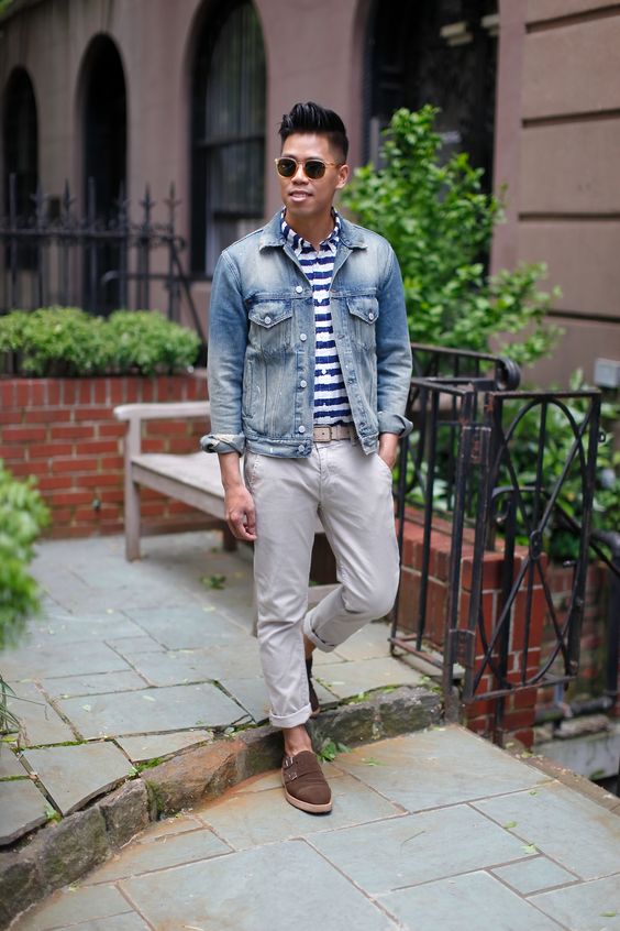light grey pants, a striped shirt, a denim jacket and brown moccasins