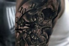 20 clock and skull melting tattoo on the shoulder