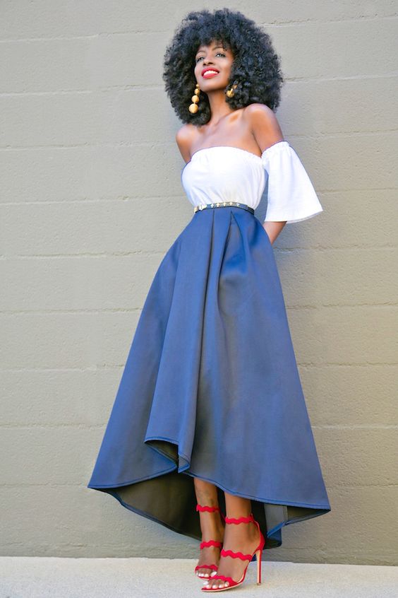 off the shoulder white top, a navy high low midi skirt and red strap sandals