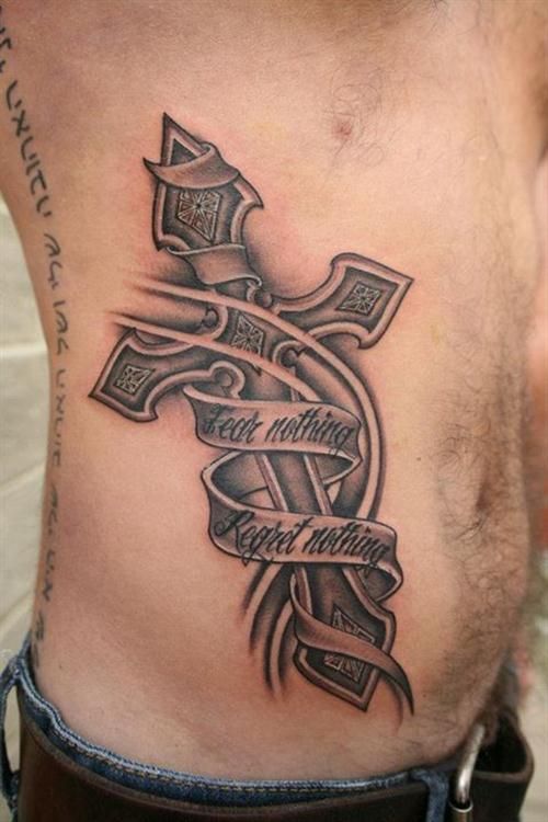 metal cross body tattoo with a meaningful quote