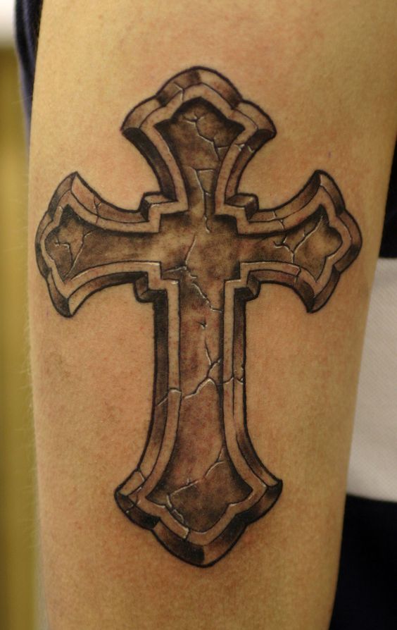 voluminous cross tattoo on an arm