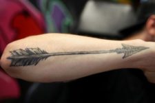 Big arrow tattoo