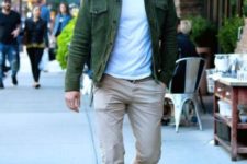 Green jacket with white t-shirt and beige pants