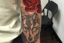 Rose with wolf tattoo on the arm