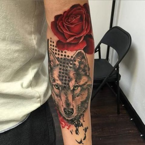 Rose with wolf tattoo on the arm