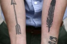 Simple arrow tattoo on the right arm