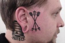 Three arrow tattoos on the face