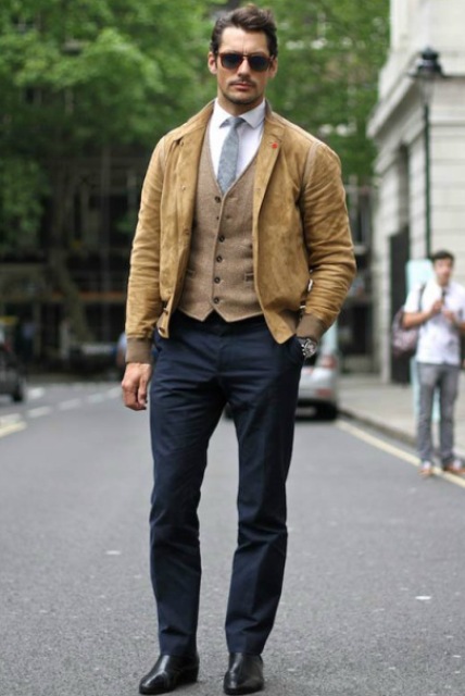 With beige vest, white shirt, gray tie and dark gray pants