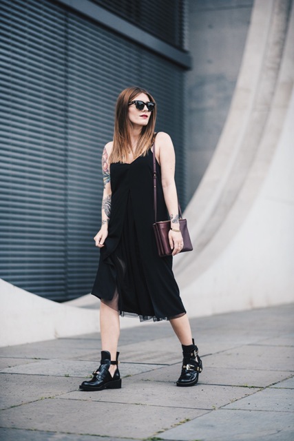 With black midi dress and colored bag