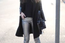 With black shirt, ankle boots, coat and leather bag