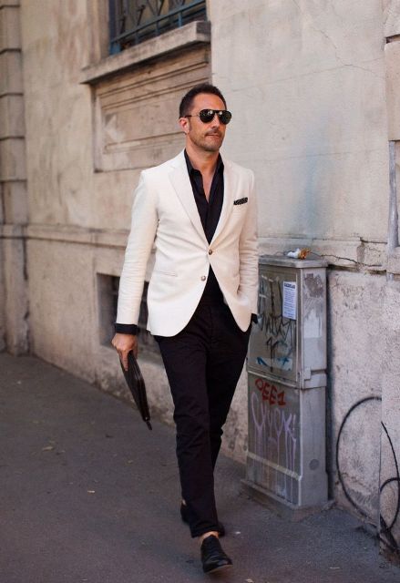 With black shirt, white blazer and black shoes