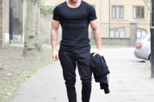 With black t-shirt and gray sneakers