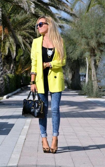 With black top, cuffed jeans, leopard shoes and black bag