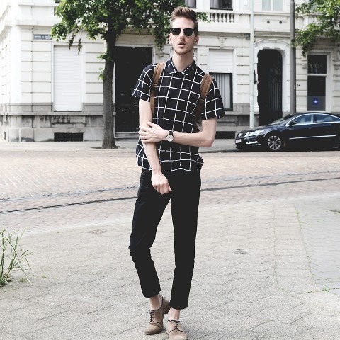 With checked shirt, brown backpack and beige shoes