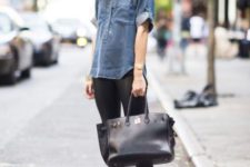 With denim shirt, black trousers and big bag