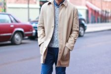 With denim shirt, gray sweater, beige coat, yellow hat and white sneakers