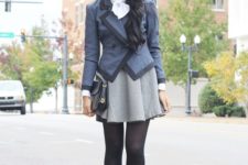 With gray and black jacket, light gray skirt and black clutch