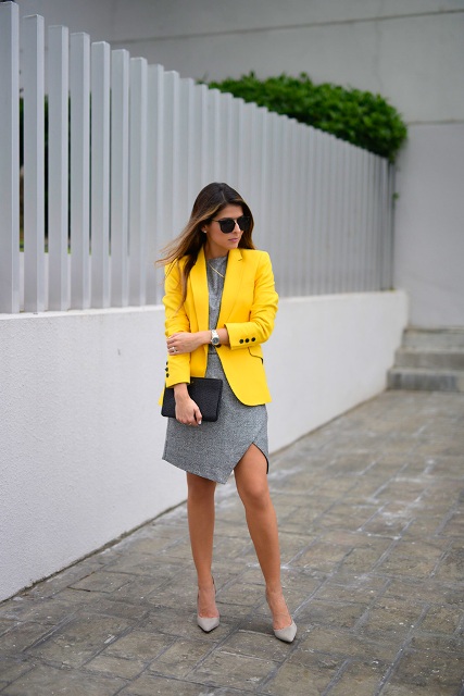 With gray dress, gray shoes and black clutch
