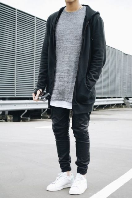 With gray long shirt, dark gray loose jacket and sporty shoes