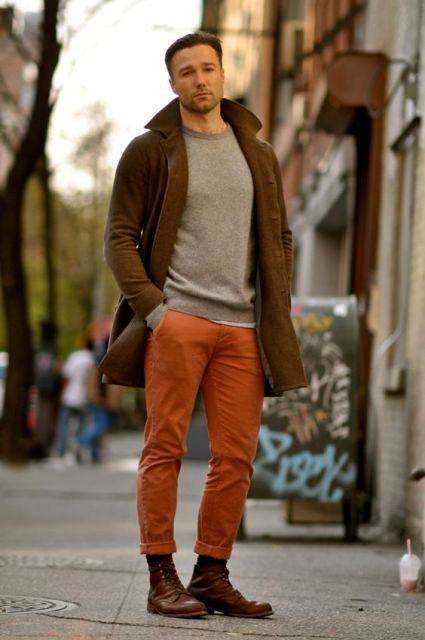 With gray sweatshirt, brown coat and brown boots